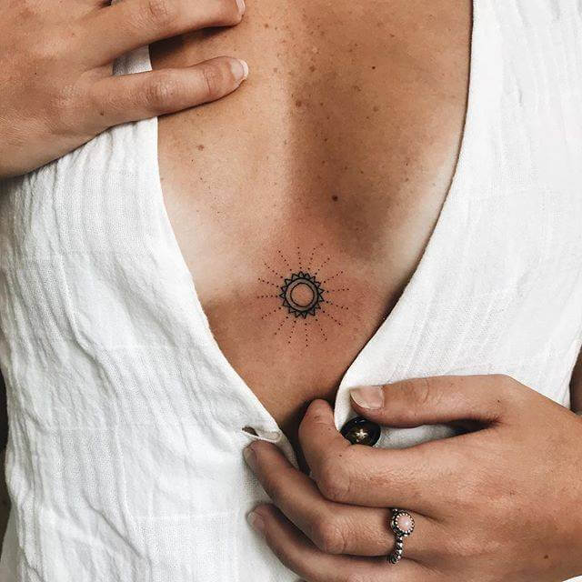 Meaningful sunshine womens sternum tattoo