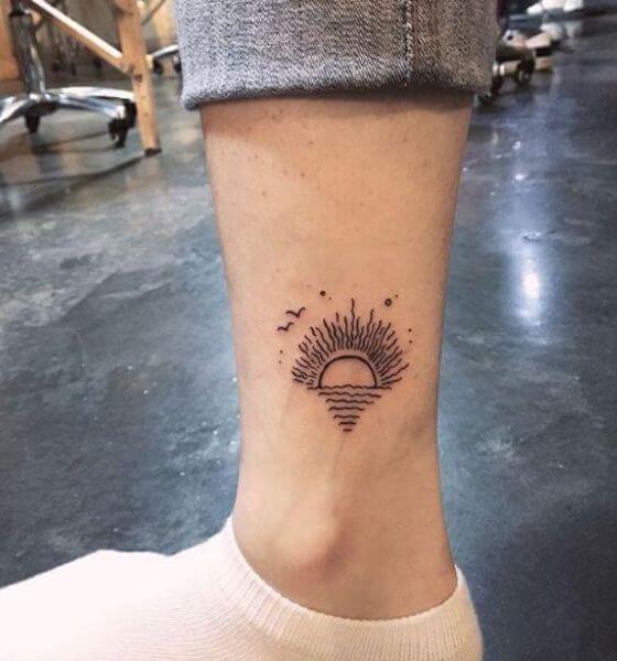 Rising sun tattoo on ankle