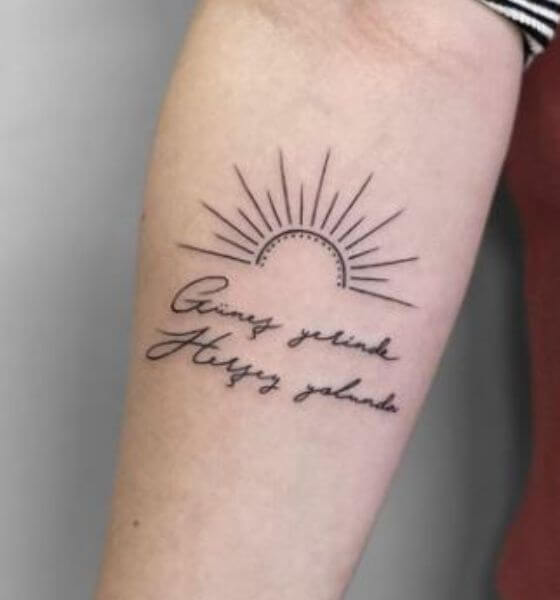 Rising sun with quote tattoo