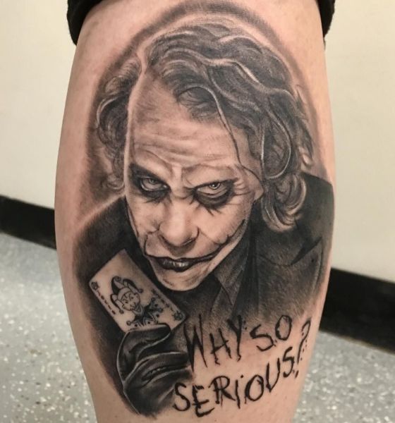 Black and grey The Joker tattoo located on the forearm