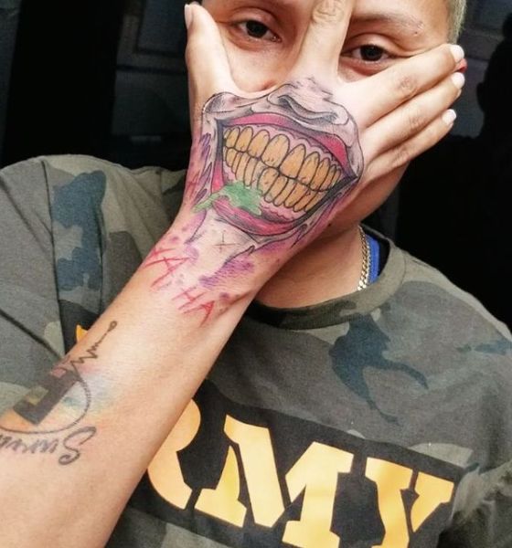 Joker Tattoo in arm with laugh