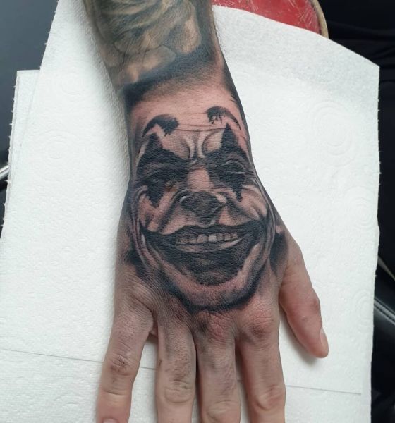 Joker Tattoo on arm with smile look