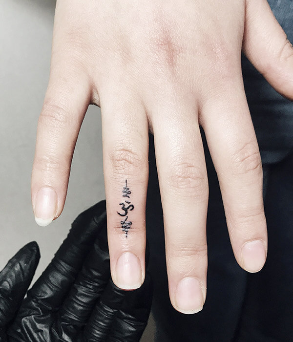 Om Symbol Tattoo Design on Finger