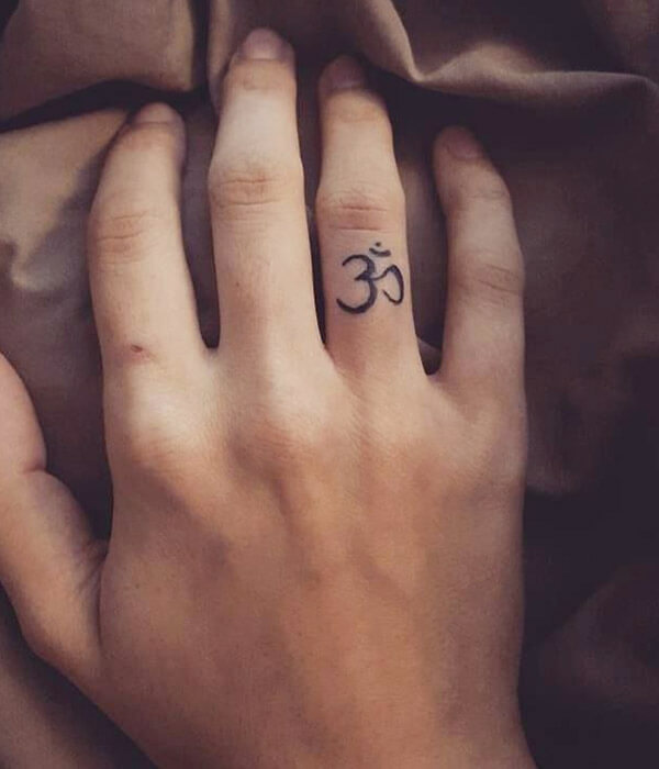 Om Symbol Tattoo on Finger