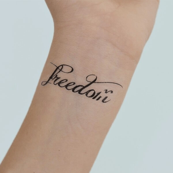 Freedom Word Tattoo on Wrist