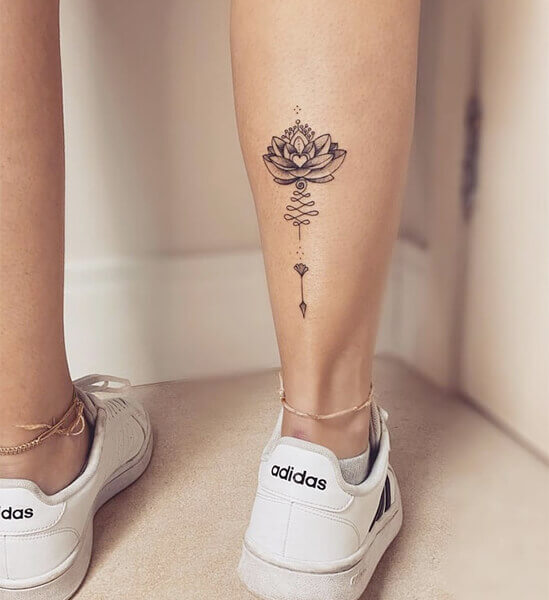 small Lotus Flower Tattoo on women leg