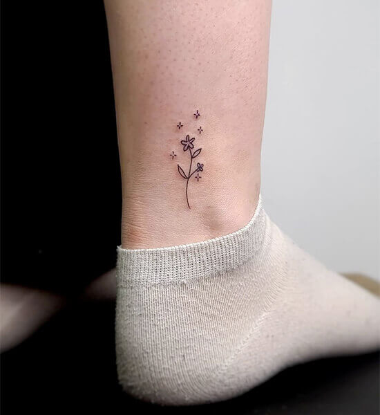 Tiny Tattoo on women's leg