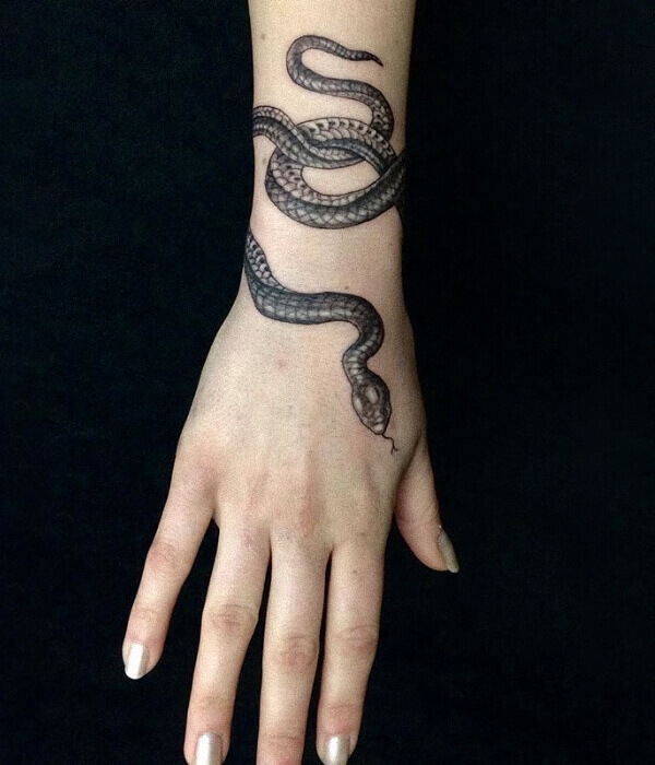 A Little pet snake Wrapped around the Wrist Tattoo
