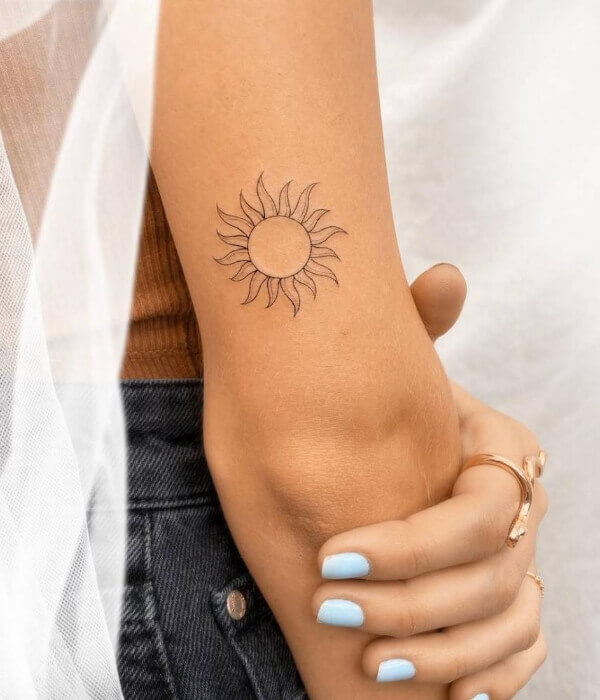 Fine line tattoo with Sun on Hand
