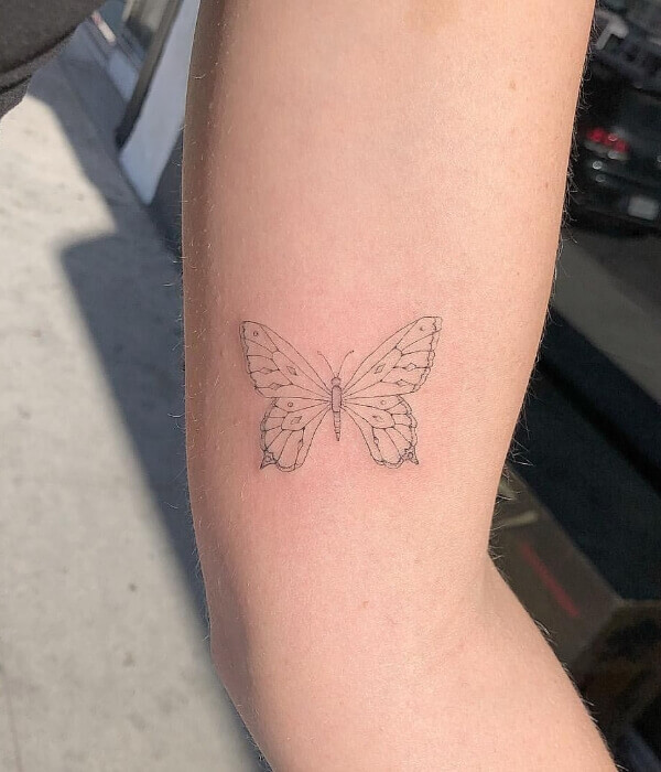 Fine line tattoo with butterfly