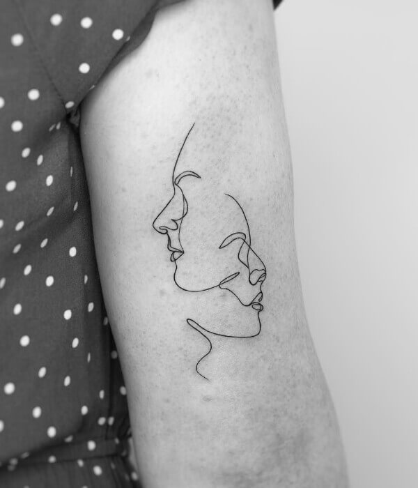 Fine line tattoo with face 