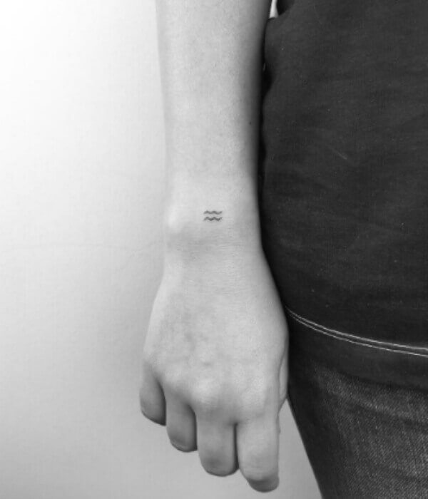 Small fine line tattoo on Hand