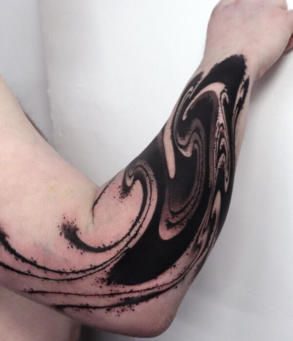 Abstract line art wrist tattoo