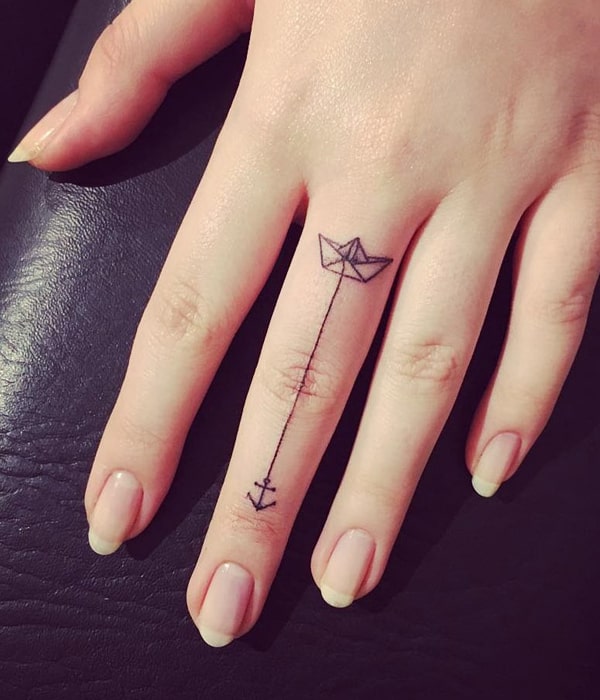 Paper Boat Tattoo on Finger