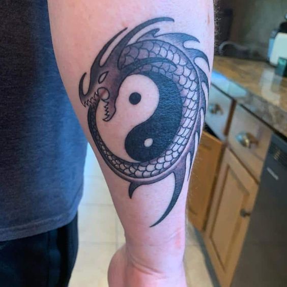 Yin and Yang Arm Tattoo