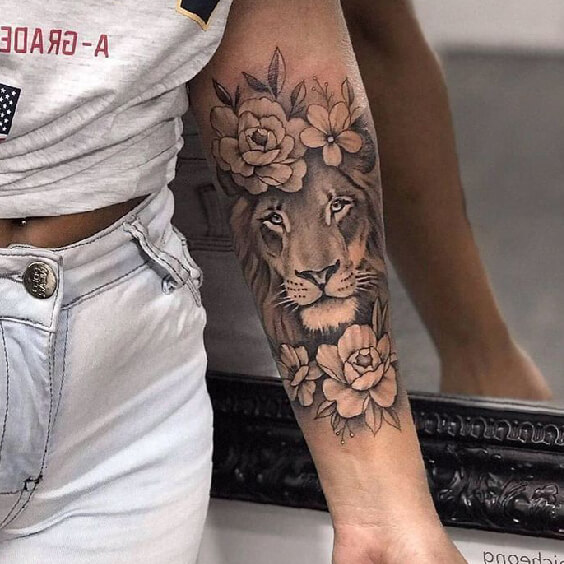 Minimalist lion emoji tattoo on the left side ribcage