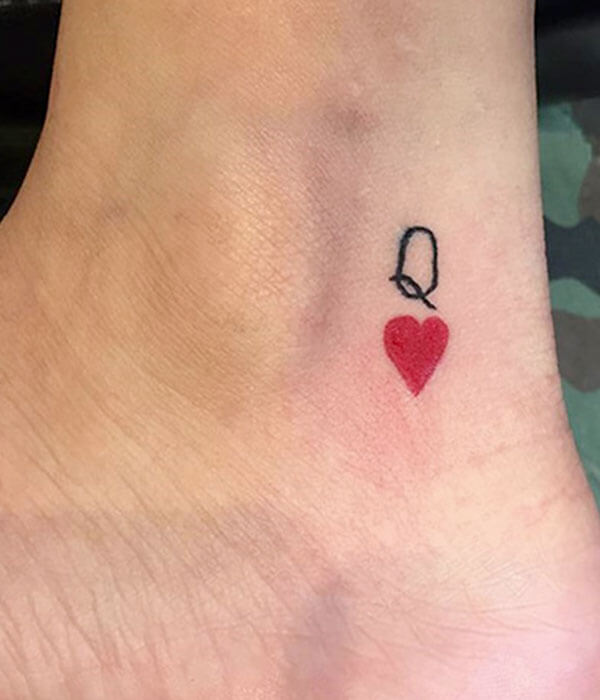 A-tiny-Queen-of-Hearts-tattoo-on-the-leg