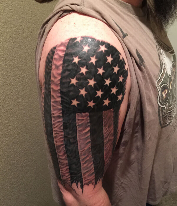 Black and gray  grey realistic American flag tattoo Done by Matty  McTatty  Shoulder sleeve tattoos Flag tattoo American flag tattoo