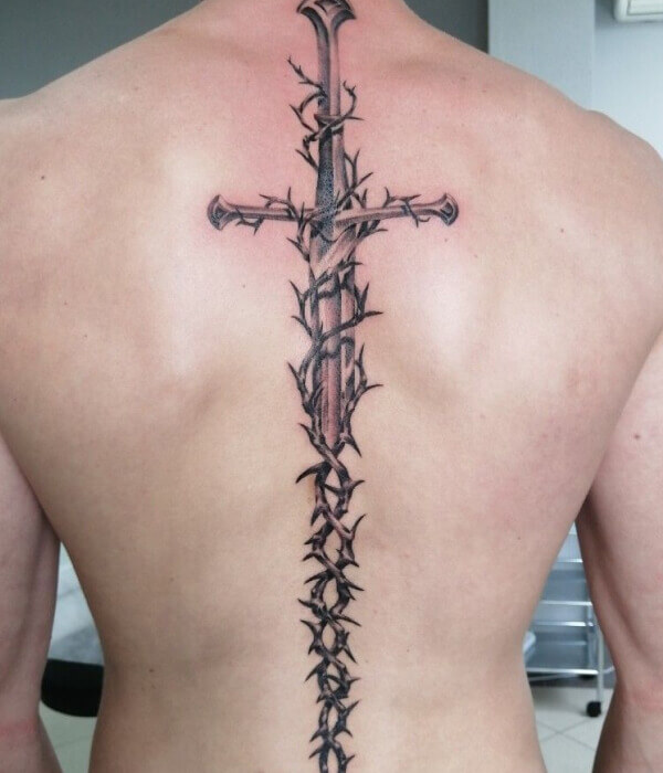 Spine tattoo with sword