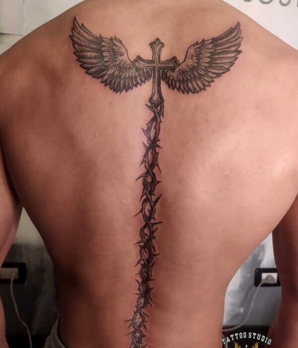 Spine tattoo with wings