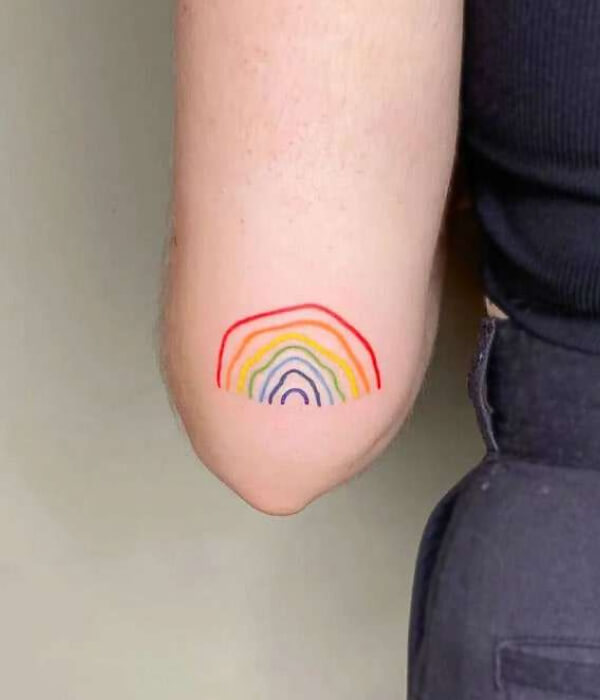 Rainbow Good Luck Tattoo on hand
