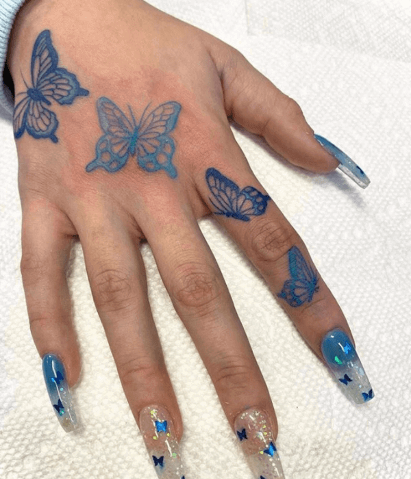 A string of blue butterfly tattoos