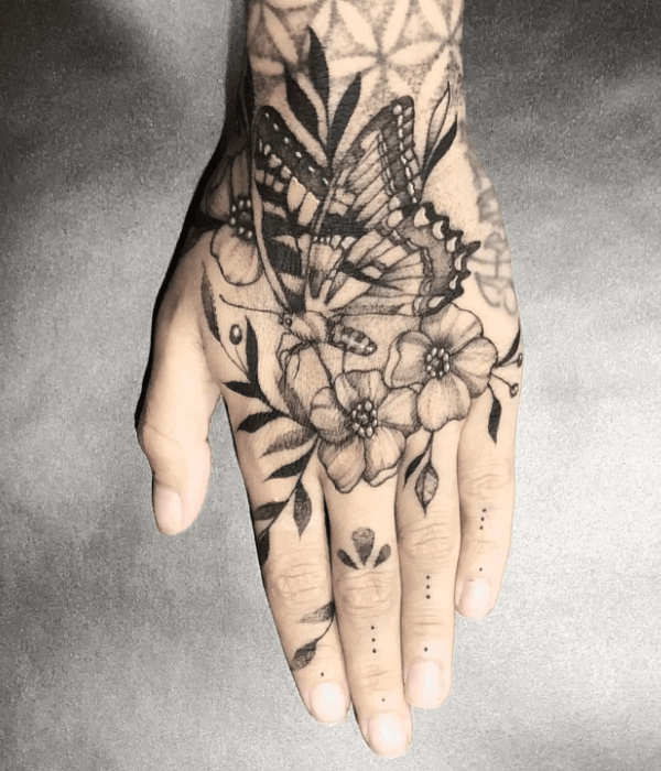 Big beautiful blackwork butterfly hand tattoo