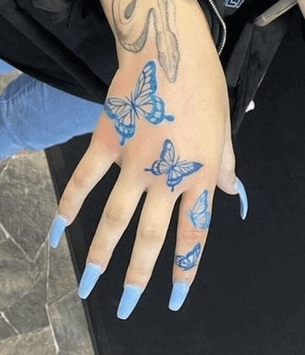 Blue butterfly hand tattoo