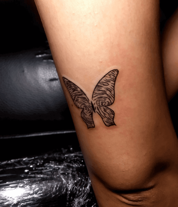 Butterfly fingerprint tattoo