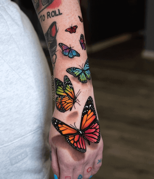 Colorful butterfly hand tattoo