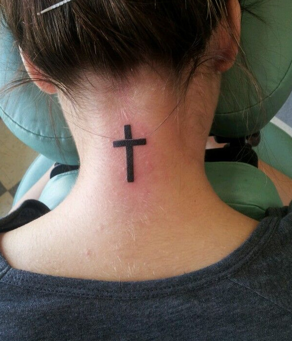Cross tattoo on the back of the neck