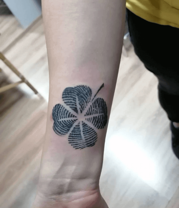 Fingerprint flower tattoo