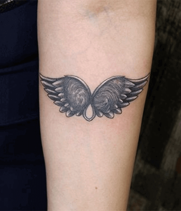 Fingerprint tattoo with wings