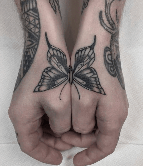 Matching butterfly hand tattoos