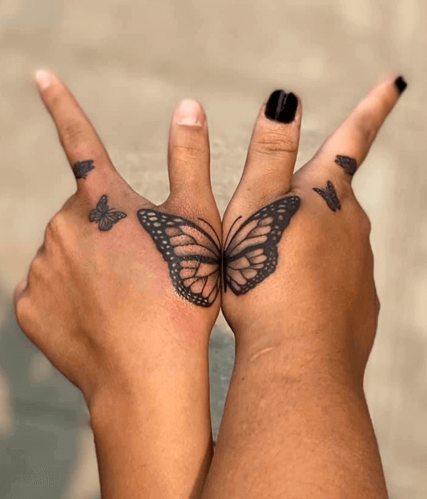 Matching butterfly hand tattoos