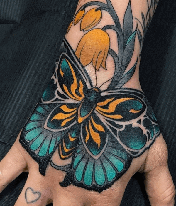 Neo traditional butterfly hand tattoo