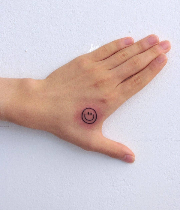 Smiley face tattoo