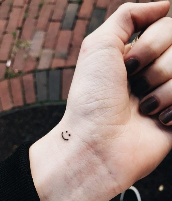 Smiley face tattoo