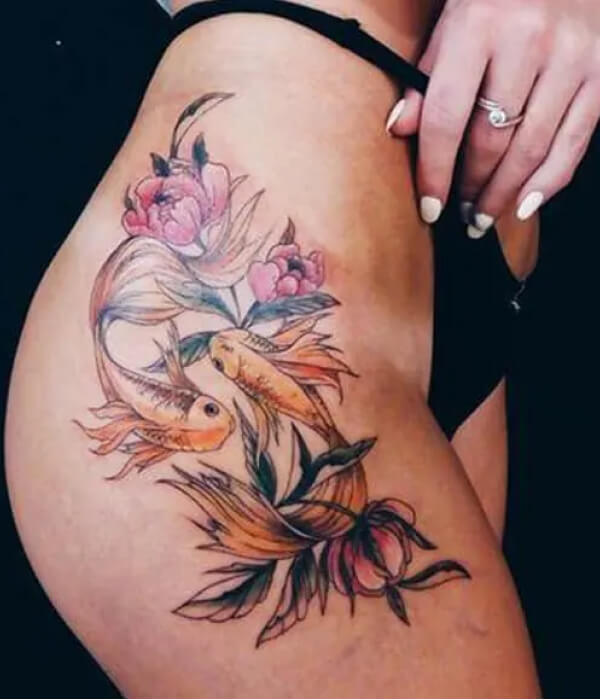 A dual mermaid thigh tattoo for Pisces females