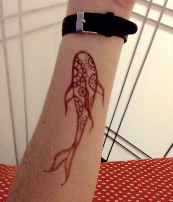 A fish hana tattoo on the hand