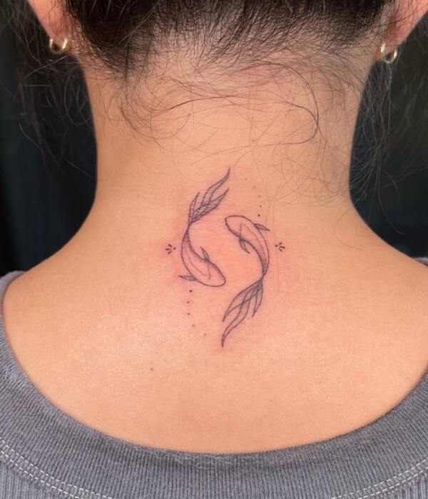 A glittering back tattoo of Pisces symbol