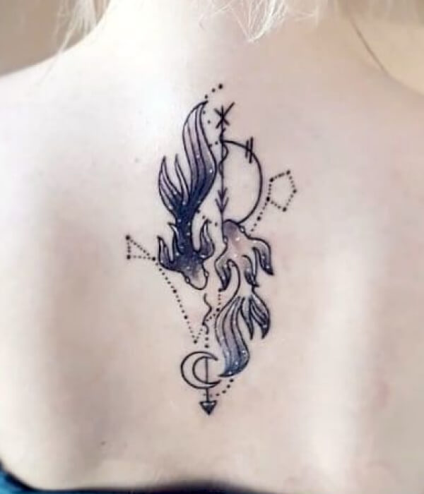 A glittering back tattoo of Pisces symbol