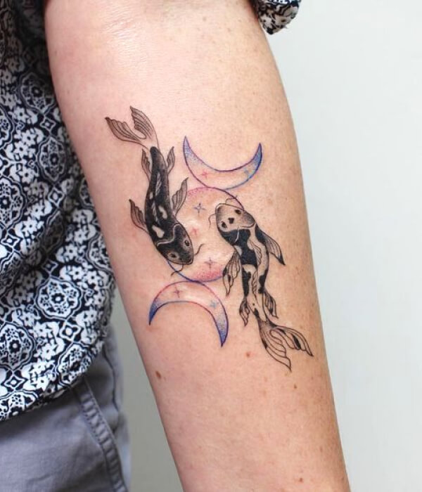 A minimalistic Pisces star and moon arm tattoo