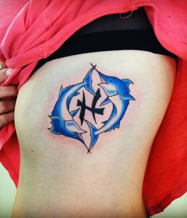 A stunning symmetrical back Pisces tattoo