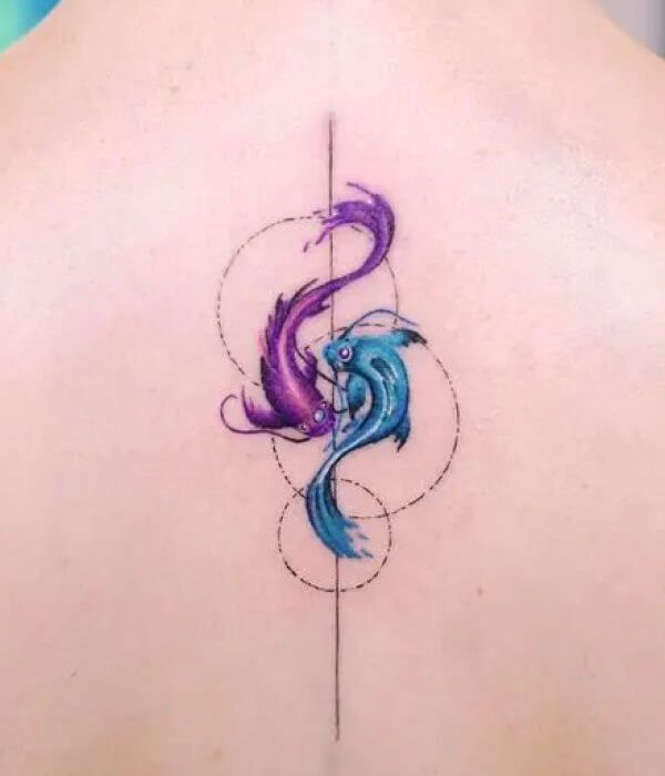 A stunning symmetrical back Pisces tattoo