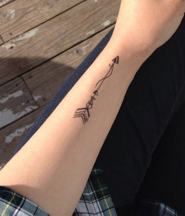 A symbolic arrow tattoo for Pisces men