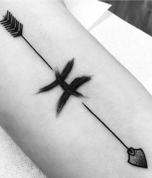 A symbolic arrow tattoo for Pisces men