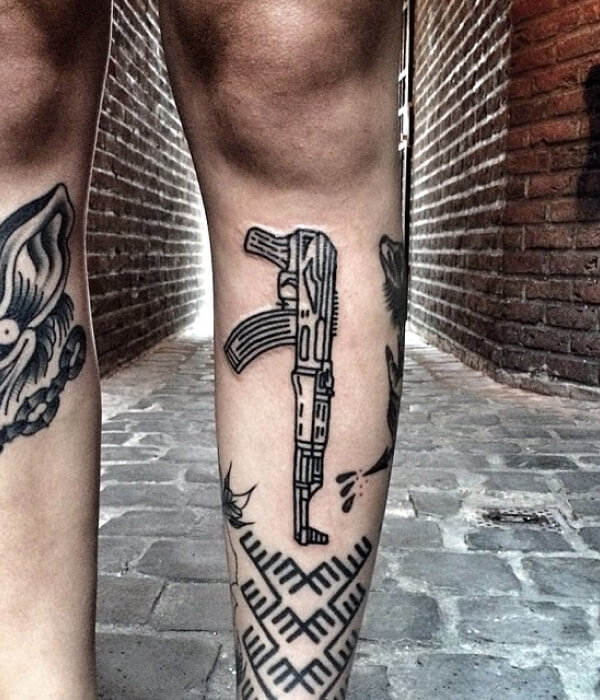 AK 47 leg tattoo