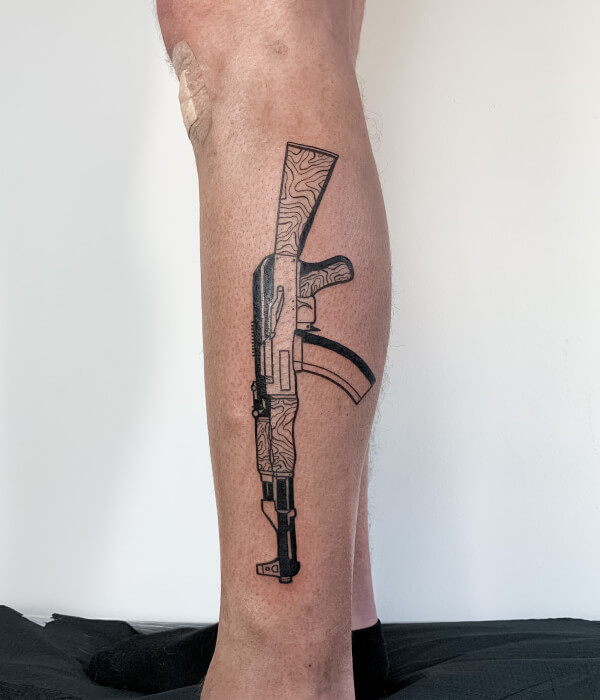 AK 47 leg tattoo