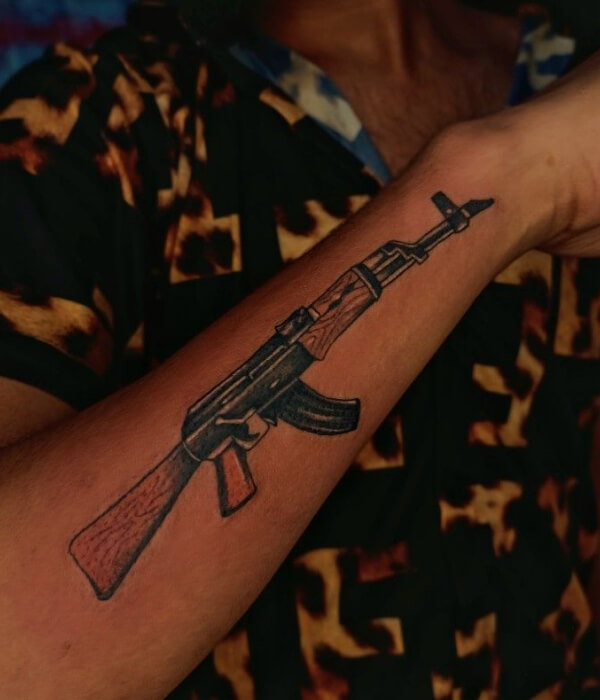 AK 47 tattoo in black and brown